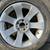 One 7 series aluminum 18x8 inch BMW stock rim and old tire 1 thumbnail