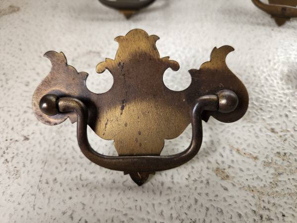 8 antique brass drawer pulls. 1