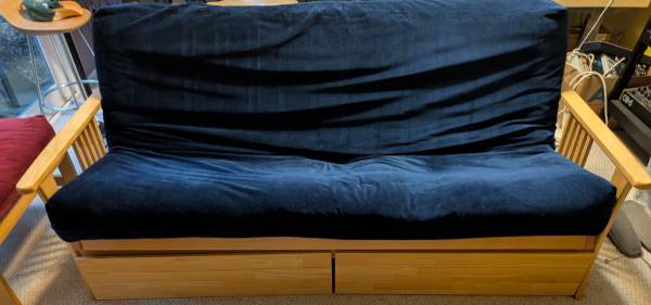 Futon with rolling storage drawers 1