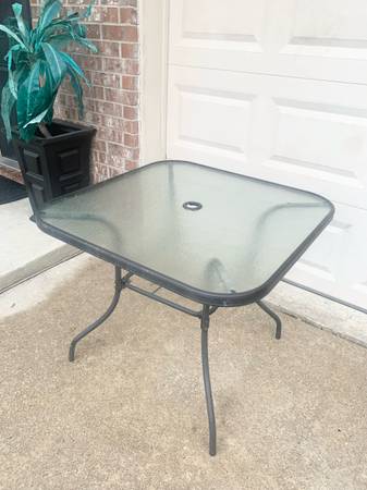 Square glass patio table with metal frame. See pictures for measurements and det 1