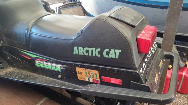 2 Artic cat snowmobiles with trailer 1