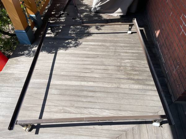 Two metal bed frames with wheels 1