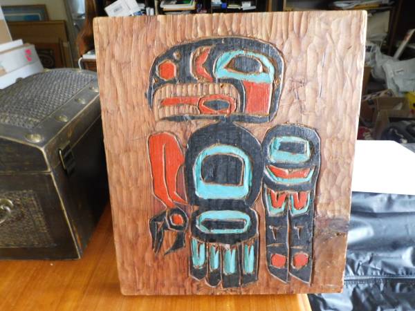 Carved formline artwork on wood by Mary Ann T, 1